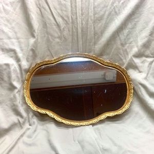 Vintage oval mirror with gold metal frame